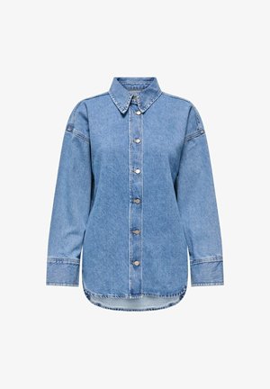 Ljusblå denimskjorta med lång ärm, knappstängning fram, spetsig krage, rundad nederkant och synliga sömnadsdetaljer.