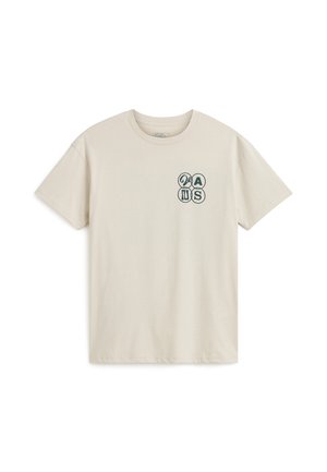 Light beige cotton t-shirt with a crew neckline. Features a small blue graphic design on the left chest area. Short sleeves, relaxed fit.