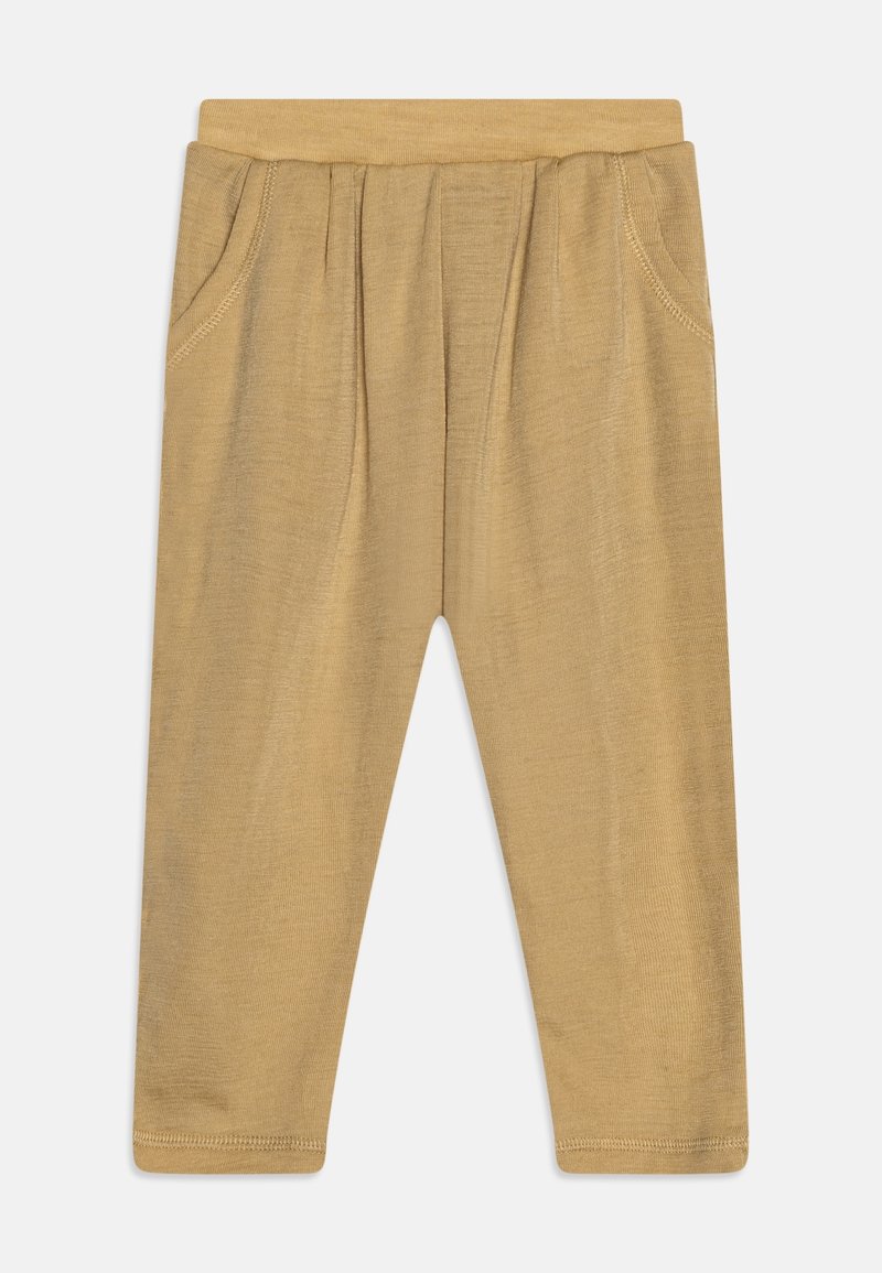 Leggings couleur fauve en tissu doux et extensible. Dotés d'une ceinture souple, de deux poches latérales et de coutures surpiquées. Design simple et épuré.