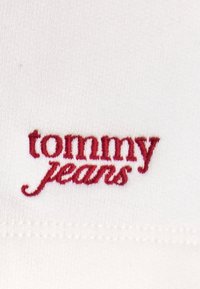 Tommy Jeans SCRIPT  - Tracksuit bottoms - ancient white