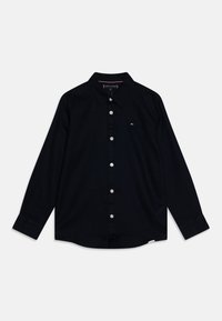 Camicia nera a maniche lunghe in tessuto tessuto, con colletto classico, chiusura a bottoni e piccolo logo sul lato sinistro del petto.