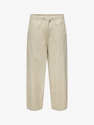 Pantalon beige décontracté avec taille élastique et cordon, jambe droite et tissu léger, présenté sur un fond blanc uni.
