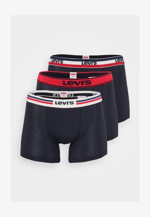 Bóxer negro para hombre, confeccionado en tela suave, con una cinturilla de contraste que muestra el nombre de la marca y rayas rojas y blancas.