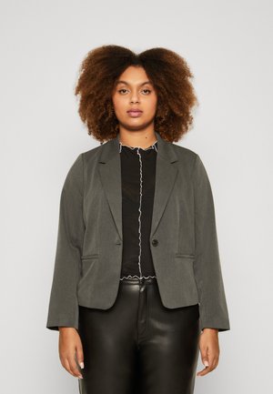 Gray blazer with a tailored fit, single button closure, and two front pockets. Worn over a black top with ruffled white trim.