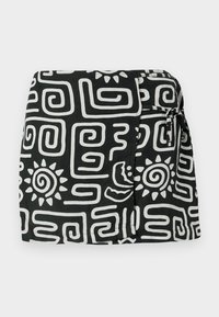 Black fabric skirt with white abstract patterns, including spirals and sun motifs, featuring a side tie closure and a relaxed fit.
