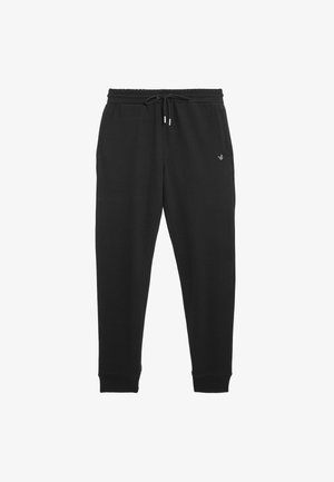 Pantalons de survêtement noirs avec taille élastique et cordon de serrage réglable. Comprend un tissu doux, des jambes fuselées et un petit logo sur la cuisse gauche.