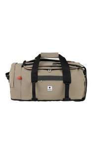Beige duffelväska med svarta remmar och detaljer. Har en framficka med dragkedja, en logotyget samt slitstarkt material. Idealisk för resor eller sport.