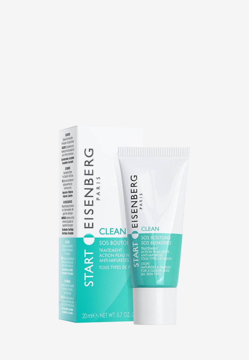 Weiße Tube mit türkisfarbenem Akzent, die 20 ml Aknebehandlung enthält. Die Verpackung enthält Texte in Französisch und Englisch und weist ein klares Design auf.