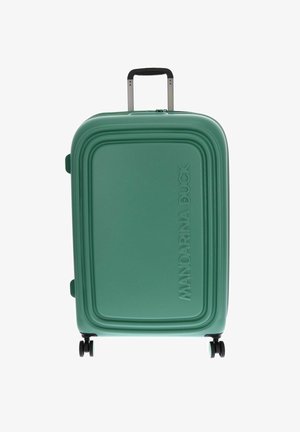 Valise rigide verte avec quatre roues et une poignée télescopique, embossée du nom de la marque Mandarina Duck à l'avant.