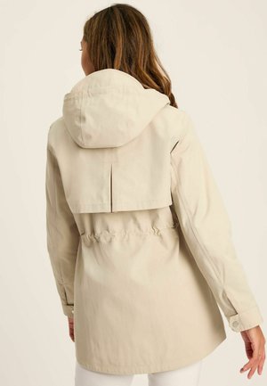 Beige leichte Jacke mit Kapuze, Kordelzug in der Taille und einem Rückenschlitz. Glatte Textur und geknöpfte Manschetten.