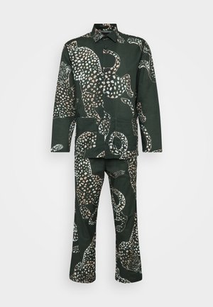 Green patterned suit featuring a long-sleeve shirt and matching pants, adorned with white and pink animal motifs on a dark background.