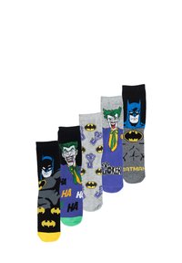 Set di quattro calzini con design di Batman e Joker. I materiali includono cotone, con colori come nero, grigio, viola e giallo, che mostrano vari motivi grafici.