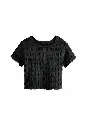 T-shirt court noir en tissu texturé avec un motif en vagues. Présente un col rond et des manches courtes avec un ourlet brut.