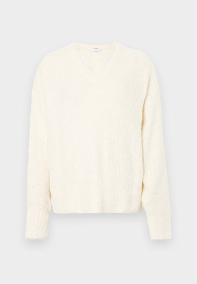 V nyakkivágású krémszínű pulóver, texturált, kötött mintával. Hosszú ujjú és laza szabású. Puha anyag, kényelmes kinézet.