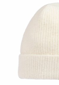 Cream-colored beanie hat made of soft, ribbed texture material with a folded cuff, featuring a simple design and neutral tone.