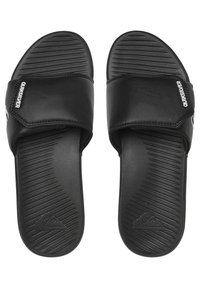 Black slide sandals made of synthetic material with a textured footbed, featuring a wide strap and logo detailing on the side.