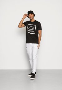 Ellesse ANDROMEDAN TEE - T-shirt print - black