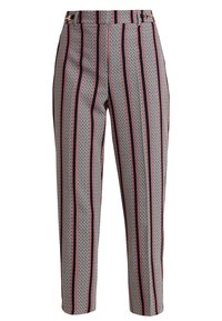 Höga skräddarsydda byxor med vertikala geometriska ränder i rött, svart och vitt, med sidospännen nära midjan.