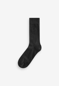 Schwarze Socke aus weichem Material, mit geripptem Bündchen, glatter Textur und einem dezenten Logo nahe dem Knöchel. Klassisches Design, mittellange Länge.
