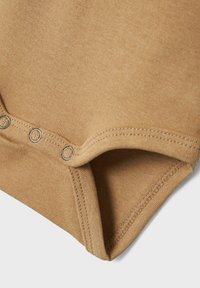 Name it STRAMPLER LANGARM - Body - tannin