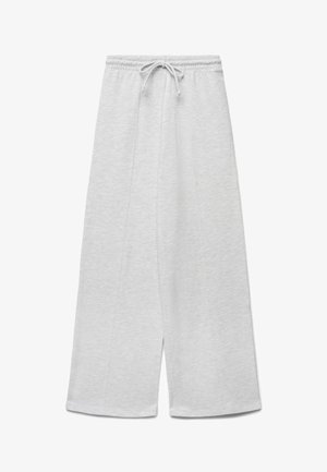 Pantalon de jogging gris clair à jambes larges avec taille élastique et cordon, présenté à plat sur fond blanc.