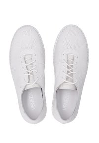 White perforated shoes with flat soles, round toe, and lace closure. Smooth leather material with textured patterns on the upper section.