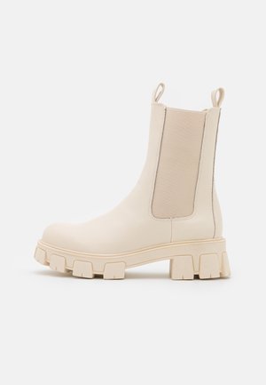 Platåstövletter - beige