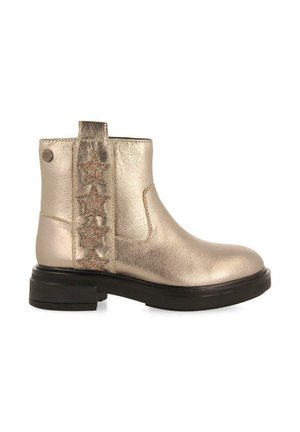 Stivaletto ankle in oro metallico con suola in gomma nera, con un dettaglio decorativo a forma di stella glitter sul lato e una linguetta sul retro.