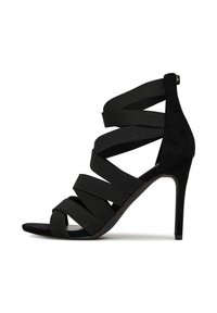 Mustad mustak kõrgpäka sandaal, millel on rihmadega disain, elastne pealmine kiht, nubuktekstuur, avatud varvapool ja stilletokonts. Tagant lukuga sulgemine.