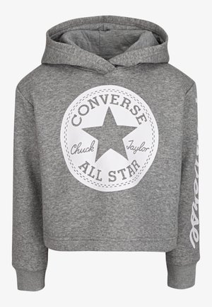 Sweat à capuche gris avec un logo blanc circulaire Converse All Star et le texte "Chuck Taylor" à l'avant.