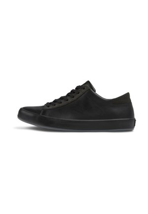 Black sneaker made of smooth leather with a cushioned sole, round toe, and lace-up closure. Features a textured accent on the heel.