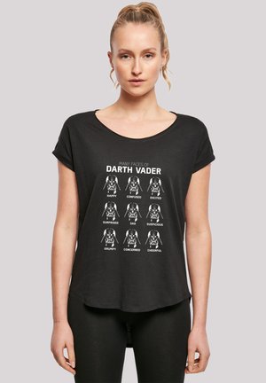 Black short-sleeve T-shirt featuring white graphic with nine Darth Vader faces, each labeled with different emotions. Rounded hem design.