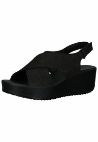 Black wedge sandals with cross-strap design and textured upper. Open toe and adjustable slingback strap. Rubber sole with grip pattern.