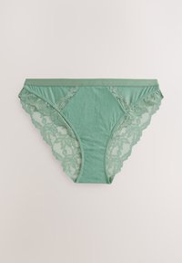 Mintgrønne trusser med blondekant, der har en bølget kant og en glat forside, lavet af et blødt, strækbart stof.