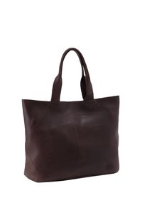 Brown leather tote bag with two handles, rectangular shape, smooth texture, and stitching detail along seams. Logo embossed on side.