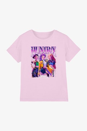 Light pink shirt with bold graphic of three animated K-pop style female characters under "HUNTRX" text, with "K-POP DEMON HUNTERS" below.