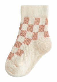 Lysbeige sok med et ternet mønster i pastelfarvet pink. Ribbet manchet, blød tekstur, ankel længde med rund tå.