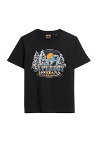 T-shirt en coton noir avec une impression graphique d'un élan, d'arbres enneigés et d'une lune, étiqueté "Superdry Montana" en bleu et blanc.