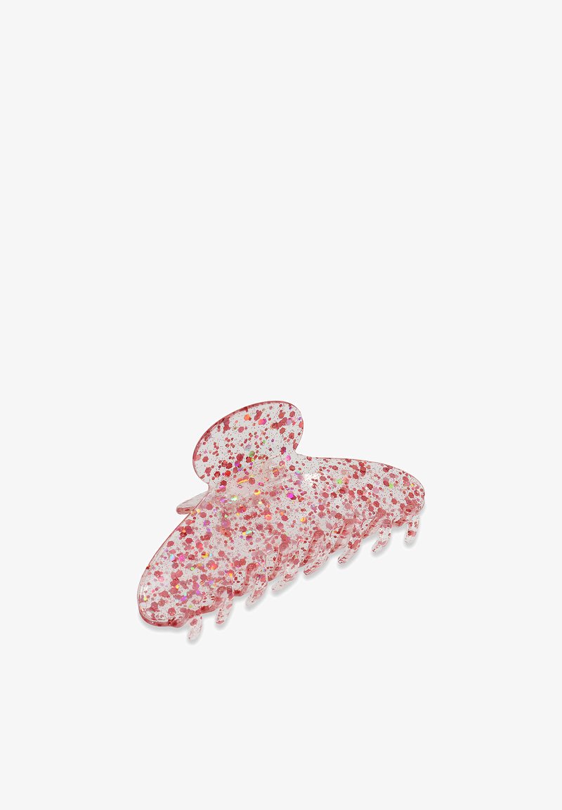 Roze glitter haarclam gemaakt van doorzichtig plastic, met een vlinder vorm voorzien van meerdere tanden voor grip en een glanzende, gestructureerde afwerking.