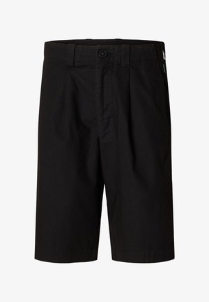 Mustad puuvillased lühikesed püksid tasase eesosaga, nööpidega kinnitatavad ja küljetaskutega. Omaduseks on lahtine lõige ja pikkus kuni reie keskosani.