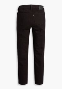 Zwarte denim jeans met een rechte pasvorm, voorzien van een middelhoge tailleband, een vijf-pocket ontwerp en een leren merkpatch op de achterkant.