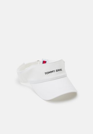 Căciulă albă cu vizor curbat, curea reglabilă și textul brodat "TOMMY JEANS" pe față. Textură de țesătură netedă.