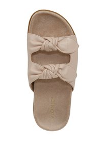 Sandalo in pelle beige con due cinturini annodati, design aperto e una morbida soletta simile al camoscio con il nome del marchio impresso.