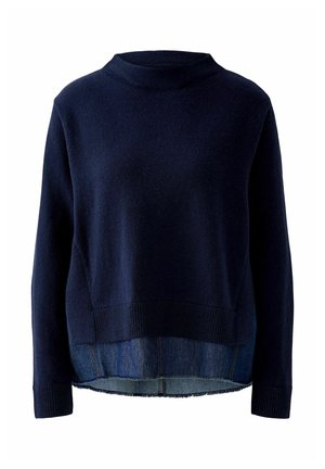 Navy knit sweater with a mock neck, ribbed hem, and layered denim bottom. Features a relaxed fit and a soft, textured fabric.