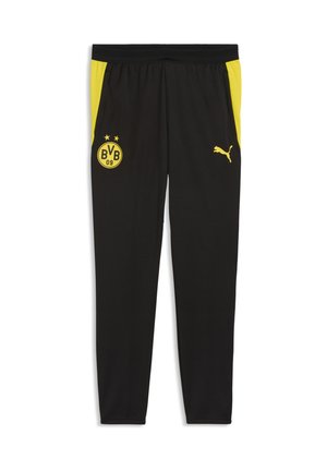 Schwarze Sporthose mit gelben Seitenpaneelen, Borussia Dortmund BVB 09-Logo am linken Oberschenkel und gelbem Puma-Logo am rechten Oberschenkel.