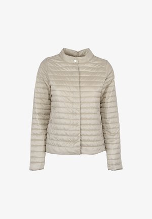 Veste matelassée beige clair avec col montant, manches longues et fermeture à pression, conçue pour la chaleur et un port décontracté.