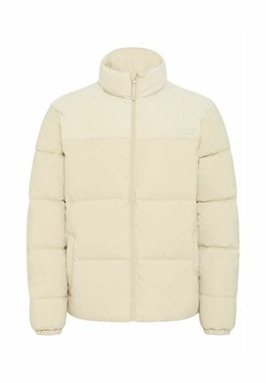 Puffjacke in hellbeige mit einem gerippten oberen Bereich. Verfügt über einen Reißverschluss vorne, elastische Bündchen und eine gesteppte Textur.