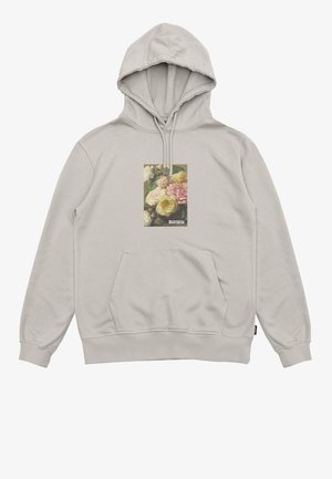 Hoodie beige avec une poche frontale, capuche à cordon réglable et un motif floral carré aux couleurs douces centré sur la poitrine.