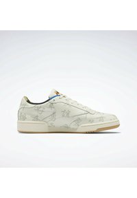 Baskets en cuir blanc avec des motifs graphiques ton sur ton, des lacets plats, un bout arrondi et une semelle en caoutchouc gomme texturée. Marque dorée sur la languette.