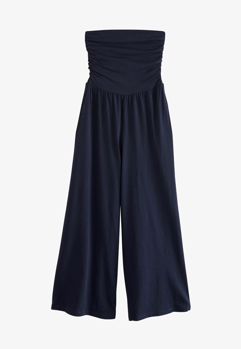 Mörkblå strapless jumpsuit med samlad överdel, vid ben-design, mjukt tyg och elastisk midja för komfort. Slät textur, avslappnad stil.